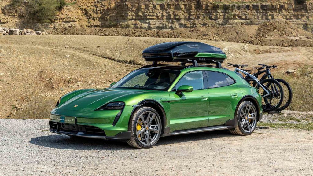 Porsche Taycan Cross Turismo with accessory cargo carrier and bike rack.