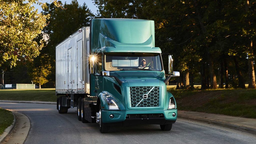 Volvo VNR electric trucks are on the road.