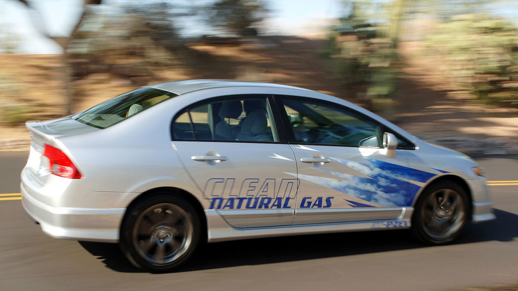 Honda Civic natural gas vehicle on the highway.