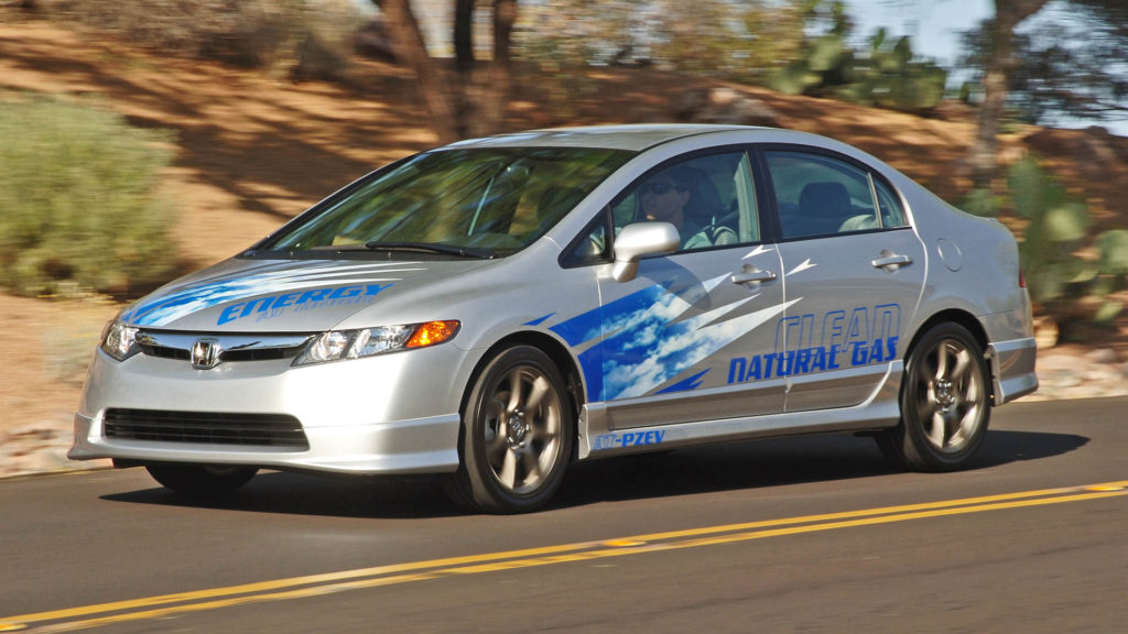 2006 Honda Civic natural gas vehicle driving on road.